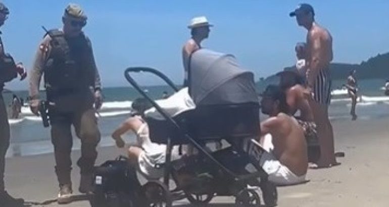 Beb&ecirc; exposto ao sol e uso de som alto na praia geram interven&ccedil;&atilde;o da PM em Balne&aacute;rio Cambori&uacute; SC
